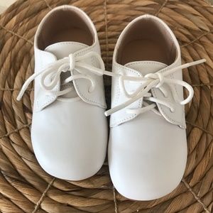 Child’s white leather shoes